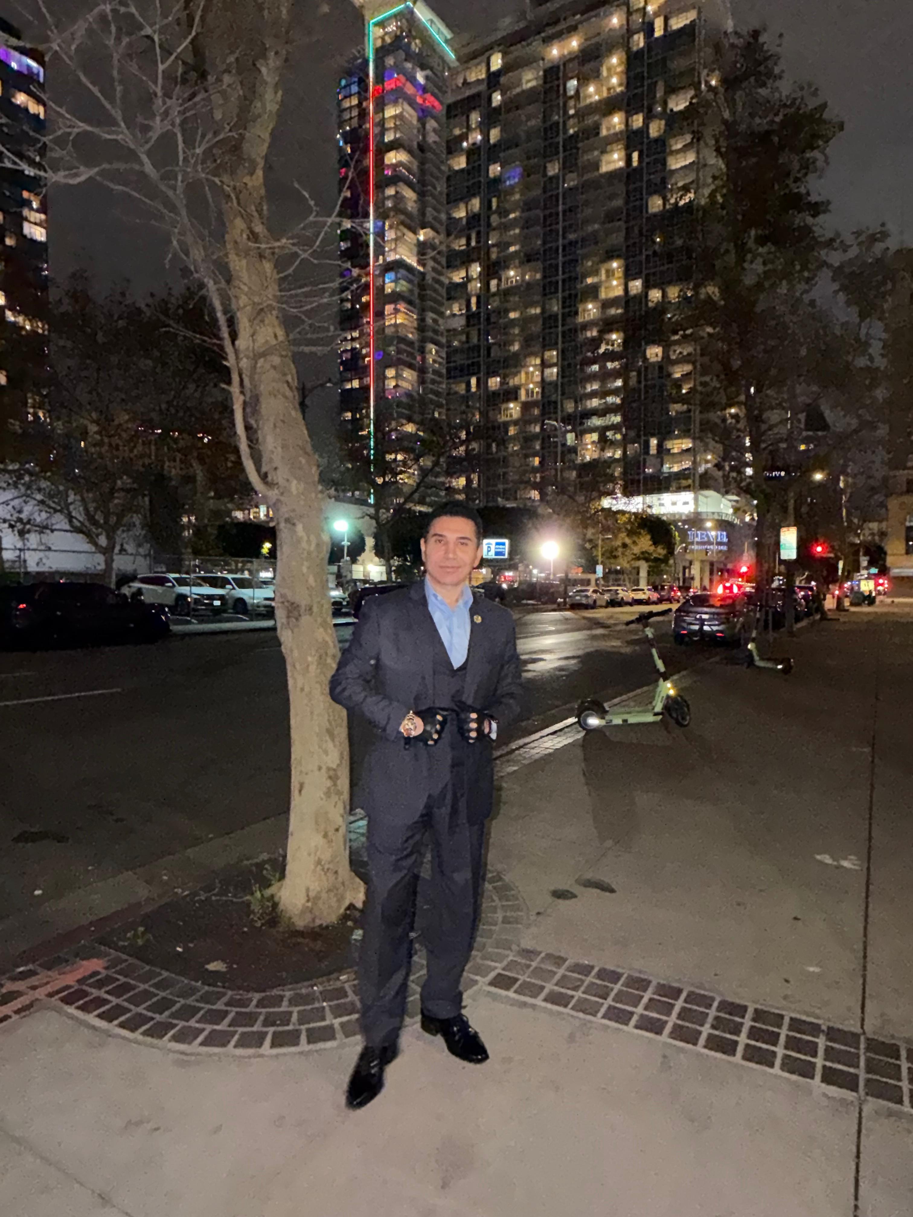 Fred Khalilian dark suit night cityscape portrait — Los Angeles downtown